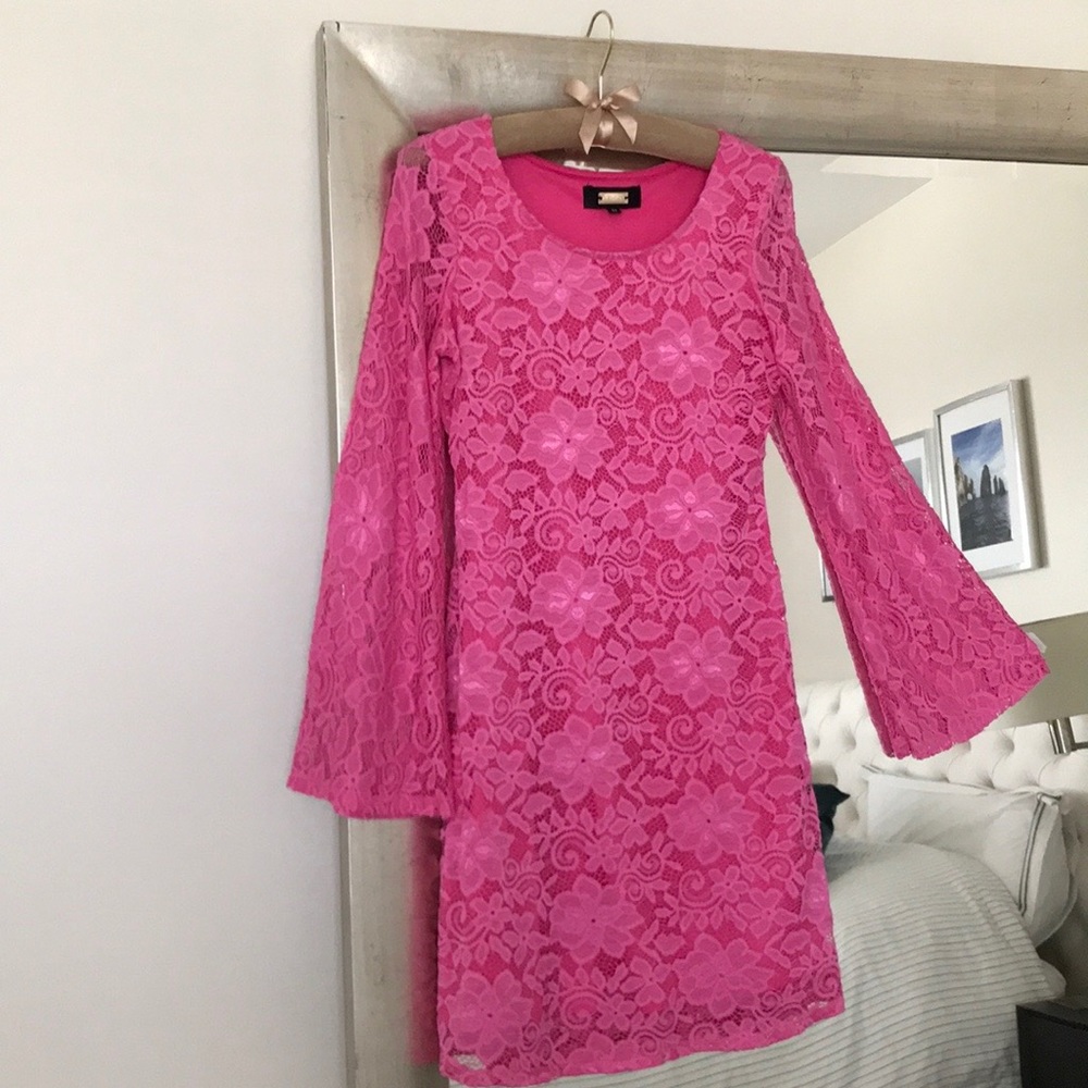 Lace dress fully lined with flared sleeves.